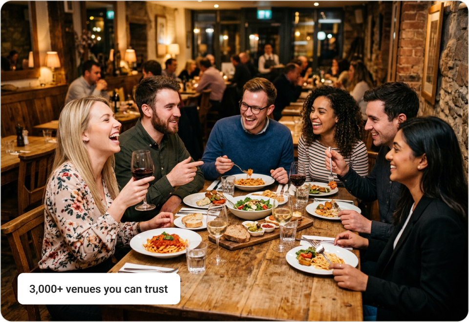 Friends eating together at a restaurant table