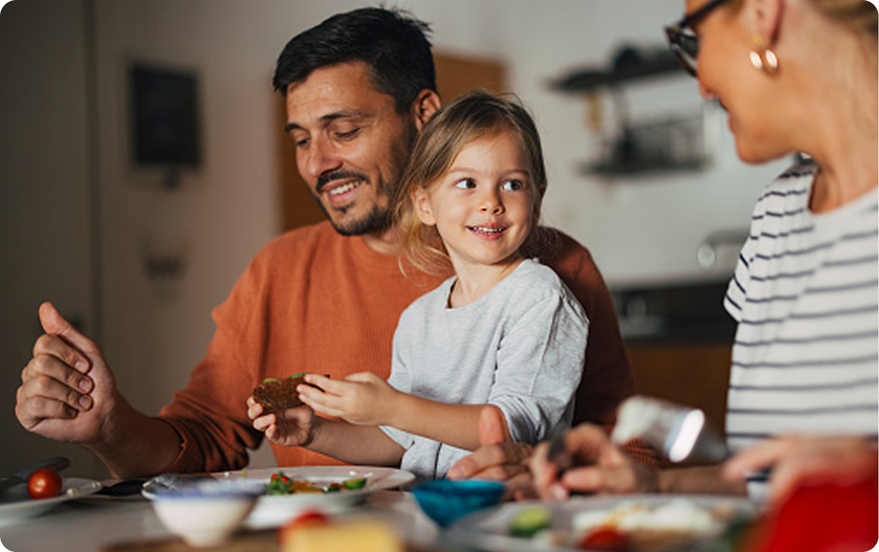 Family sharing a meal together at a kitchen table