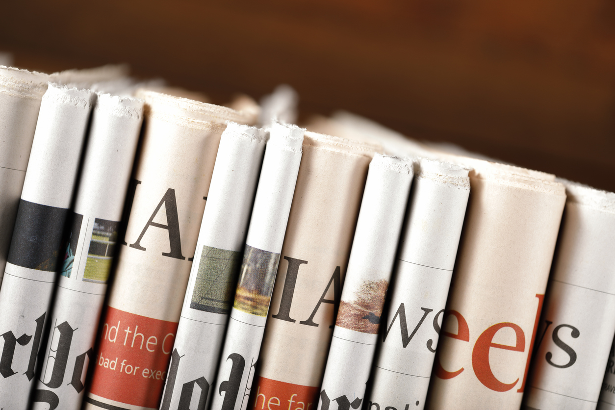 Newspapers in a line