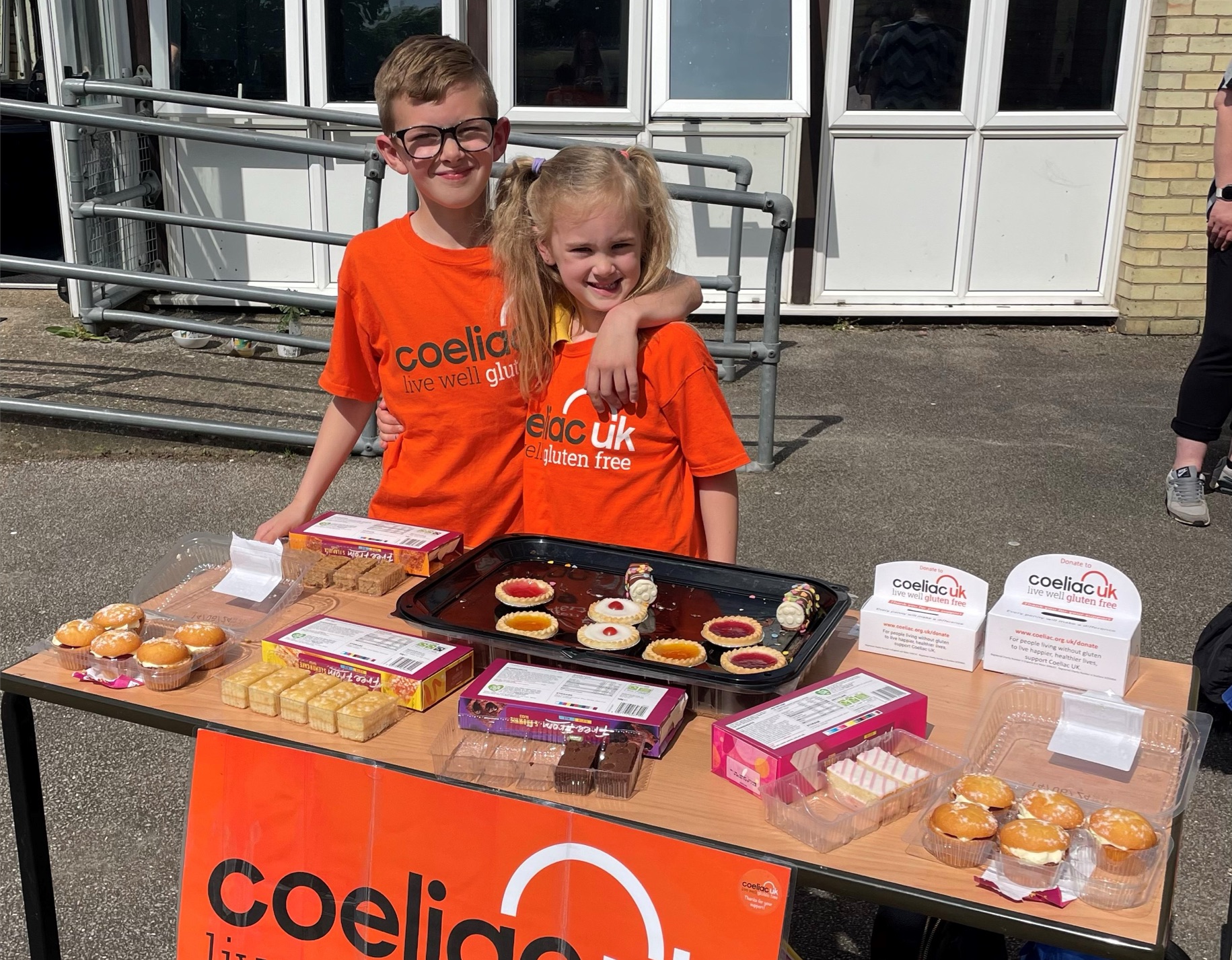 boy and girl selling cakes